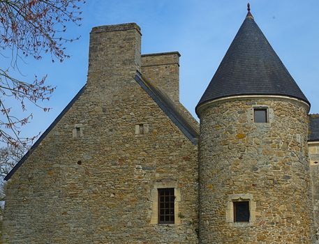 Part of stone medieval castle with round tower