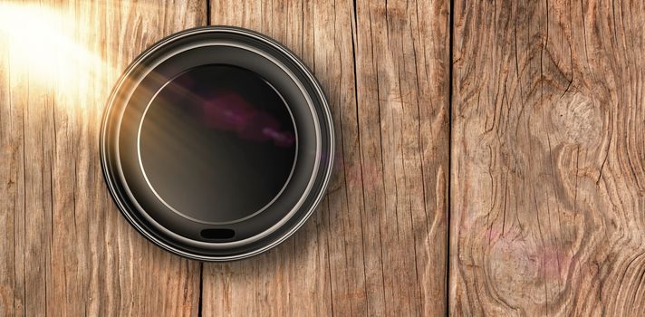 Overhead of cup over white background against close-up of wooden texture