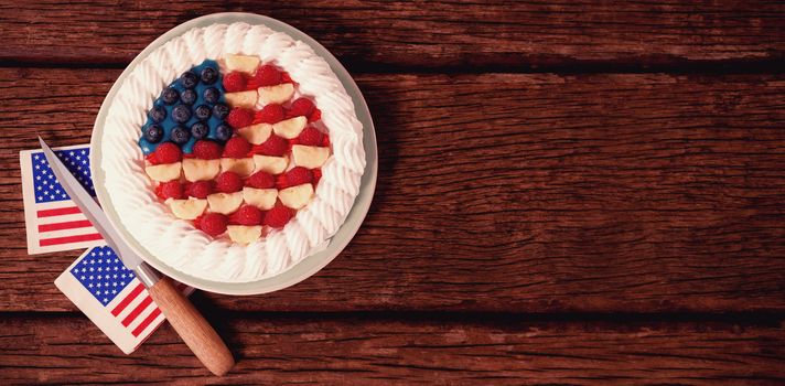 Fruitcake with 4th july theme on wooden table
