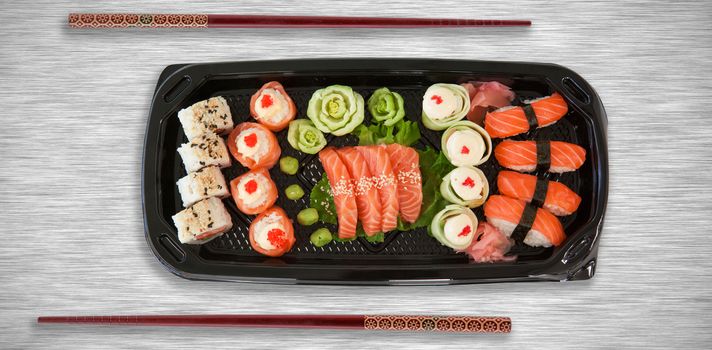 High angle view of fresh food in tray against grey texture background