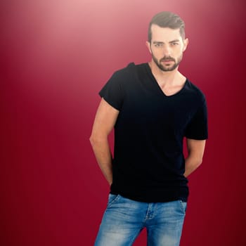 Portrait of young man against white background against pink background 