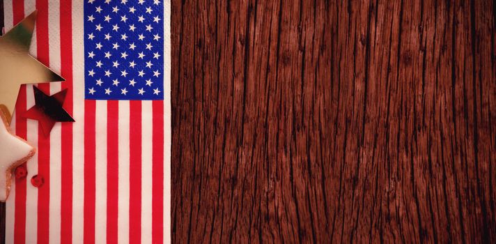 American flag and star shape decoration arranged on wooden table with 4th July theme