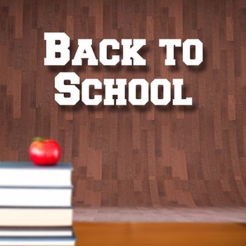 Back to school message against red apple on pile of books