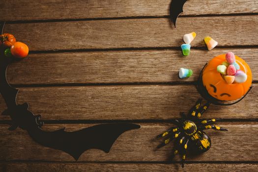 Overhead view of decoration with sweet food on table during Halloween