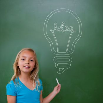 Idea and innovation graphic against cute pupil holding chalk