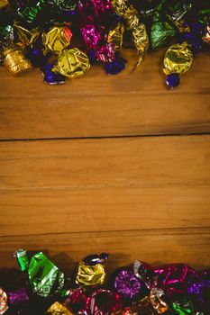 High angle view of colorful wrapped chocolates on table during Halloween