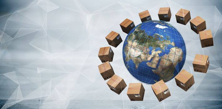 World map amidst brown cardboard boxes against abstract glowing black background