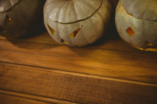 High angle view of jack o lanterns arranged on table during Halloween