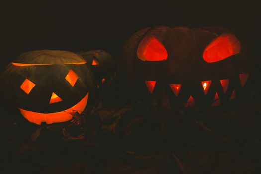 Jack o lantern glowing in darkroom during Halloween