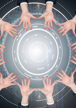 Digital composite of Hands in circle around technology user interface