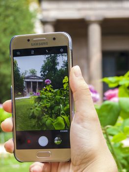 Smartphone photo in front of the Mausoleum in the castle garden Charlottenburg. Berlin, Germany.