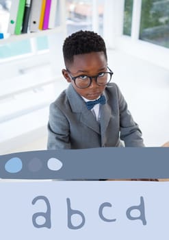 Digital composite of Education icon against office kid boy looking up background