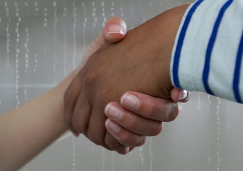 Digital composite of Business people shaking hands against grey background