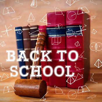 Back to school message against gavel with books