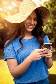 Brunette women wearing summer hat  against van with floral pattern parked