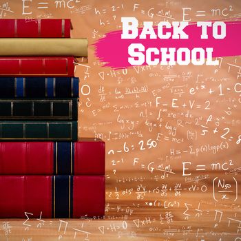 Back to school message against books stack on table