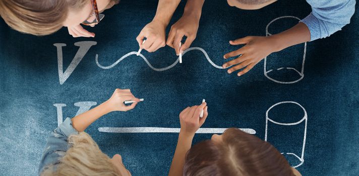 Business people writing with chalks against black background