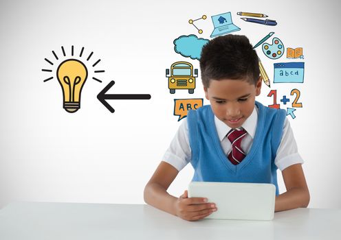 Digital composite of Schoolboy on tablet with education light bulb graphics