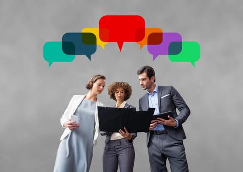 Digital composite of Business people with speech bubbles against grey background