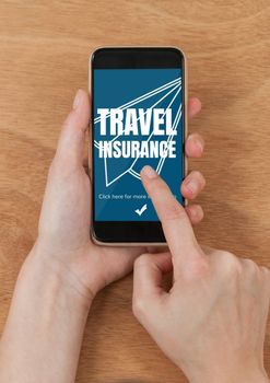 Digital composite of Person using a phone with travel insurance concept on screen