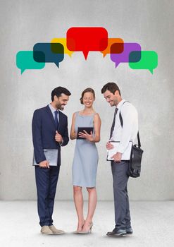 Digital composite of Business people with speech bubble looking at a tablet against grey background