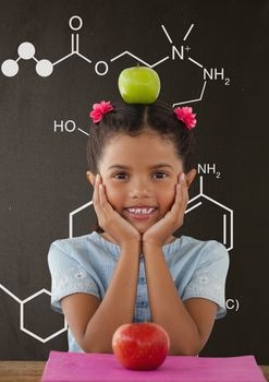 Digital composite of Happy student girl at table against grey blackboard with school and education graphic