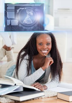 Digital composite of Female Student studying with book and science education interface graphics overlay