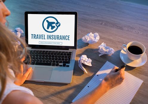 Digital composite of Woman using a computer with travel insurance concept on screen