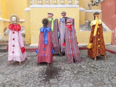 Antigua traditional dress of Guatemala on dummies, manikins, statues outside in the square for Independence day. Central America dress and clothes.