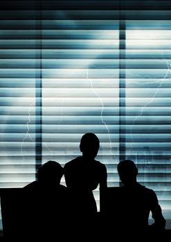 Digital composite of Business people silhouettes against building