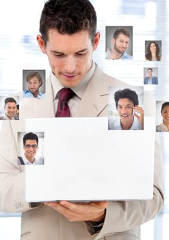 Digital composite of Man holding laptop with Profile portraits of people contacts