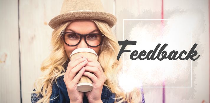 Feedback text against white background  against portrait of smiling fashionable woman drinking coffee outdoors