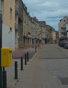 CHERBOURG, FRANCE - June 6th 2019 - Empty street with stone building in traditional town