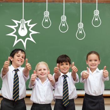 Idea and innovation graphic against cute pupils showing thumbs up in classroom