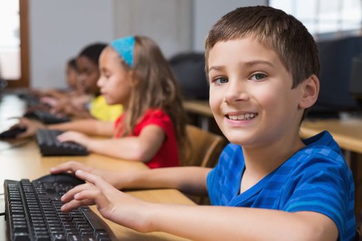 Cute pupils in computer class at the elementary school