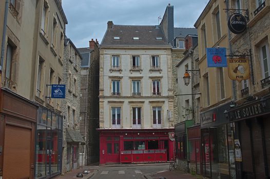 CHERBOURG, FRANCE - June 6th 2019 - Empty street with stone building in traditional town