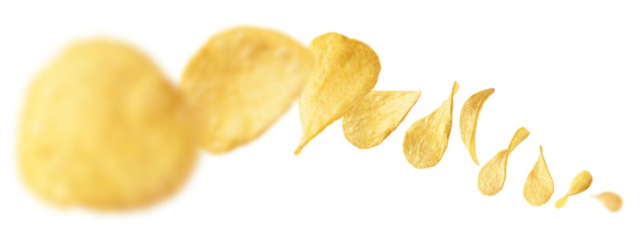 Potato chips levitate on a white background.