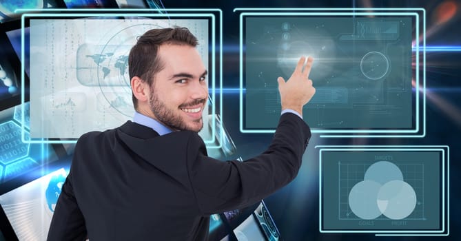 Digital composite of Businessman touching and interacting with technology interface panels