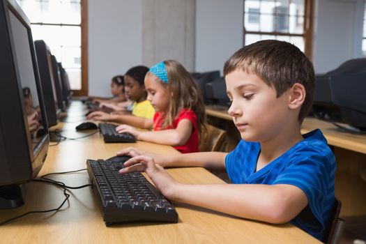 Cute pupils in computer class at the elementary school