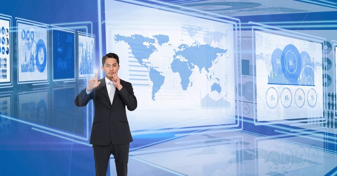 Digital composite of Businessman touching and interacting with technology interface panels