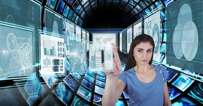 Digital composite of Businesswoman touching and interacting with technology interface panels