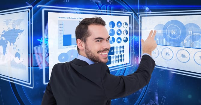 Digital composite of Businessman touching and interacting with technology interface panels