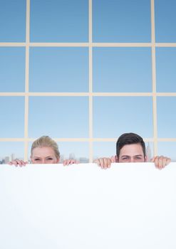 Digital composite of Business people holding blank card in office