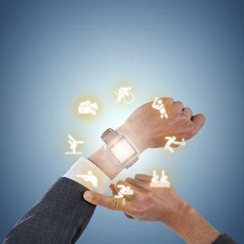 Cropped hand of businessman wearing smart watch against purple vignette