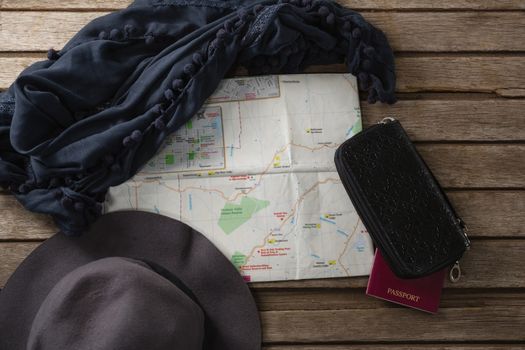 Overhead of travel accessories on wooden table