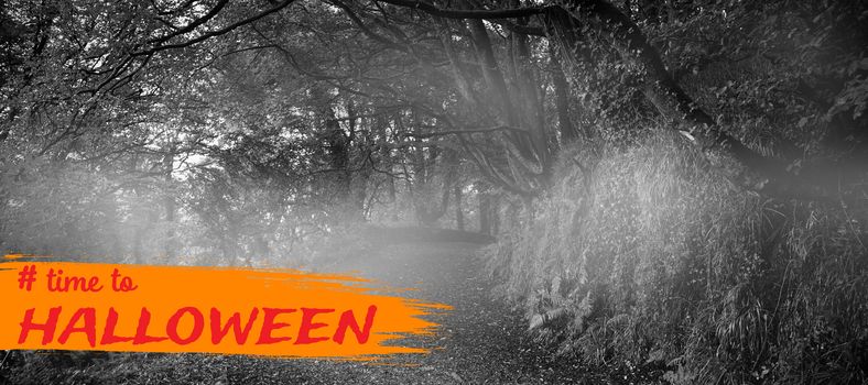 Graphic image of time to Halloween text against dark way in the woods