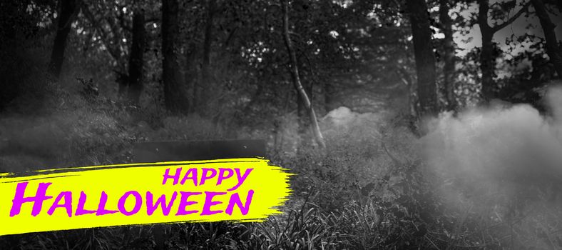 Digital image of happy Halloween text against bench in the woods 