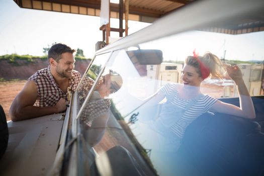 Romantic couple with a car in petrol pump