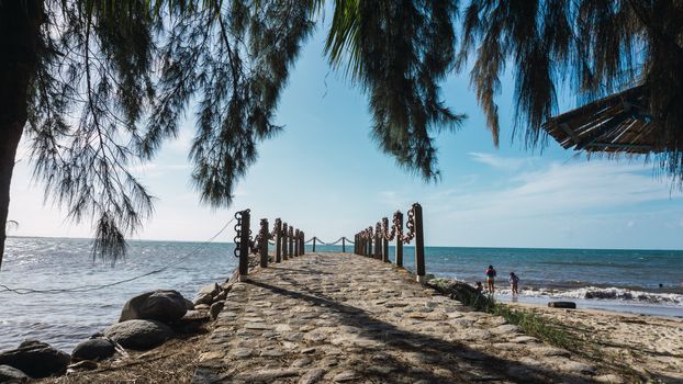 Beautiful view on the pier with a blue sky and ocean