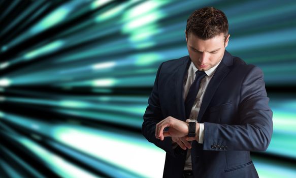 Handsome businessman checking the time against abstract turquoise glowing background